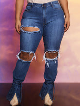 Vaqueros acampanados con cortes y cintura alta de mezclilla